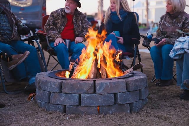 People gathered around a fire pit