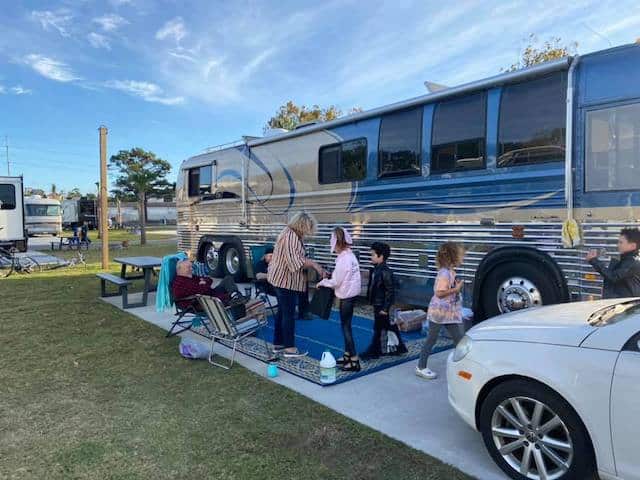 A family having fun beside their RV