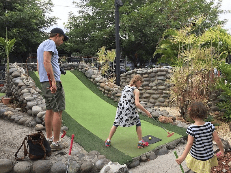 A family having fun at Jungle Safari Mini Golf