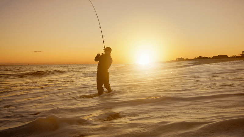 A man fishing in the sea