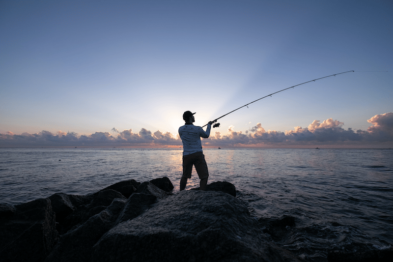 A man fishing on a lake