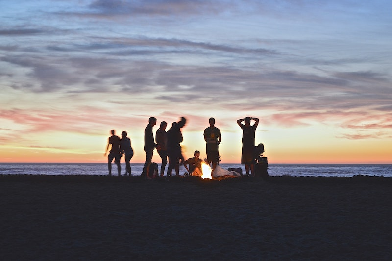 A couple of friends playing in the beach 