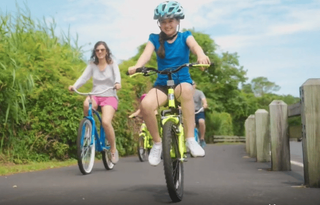 A Family Having Fun with their bikes At Litchfield Beach