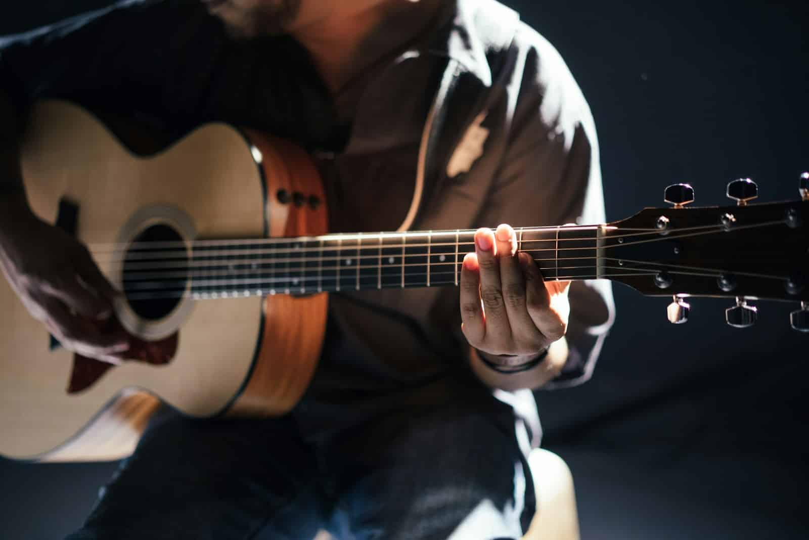 person playing guitar Carolina Country Music Fest