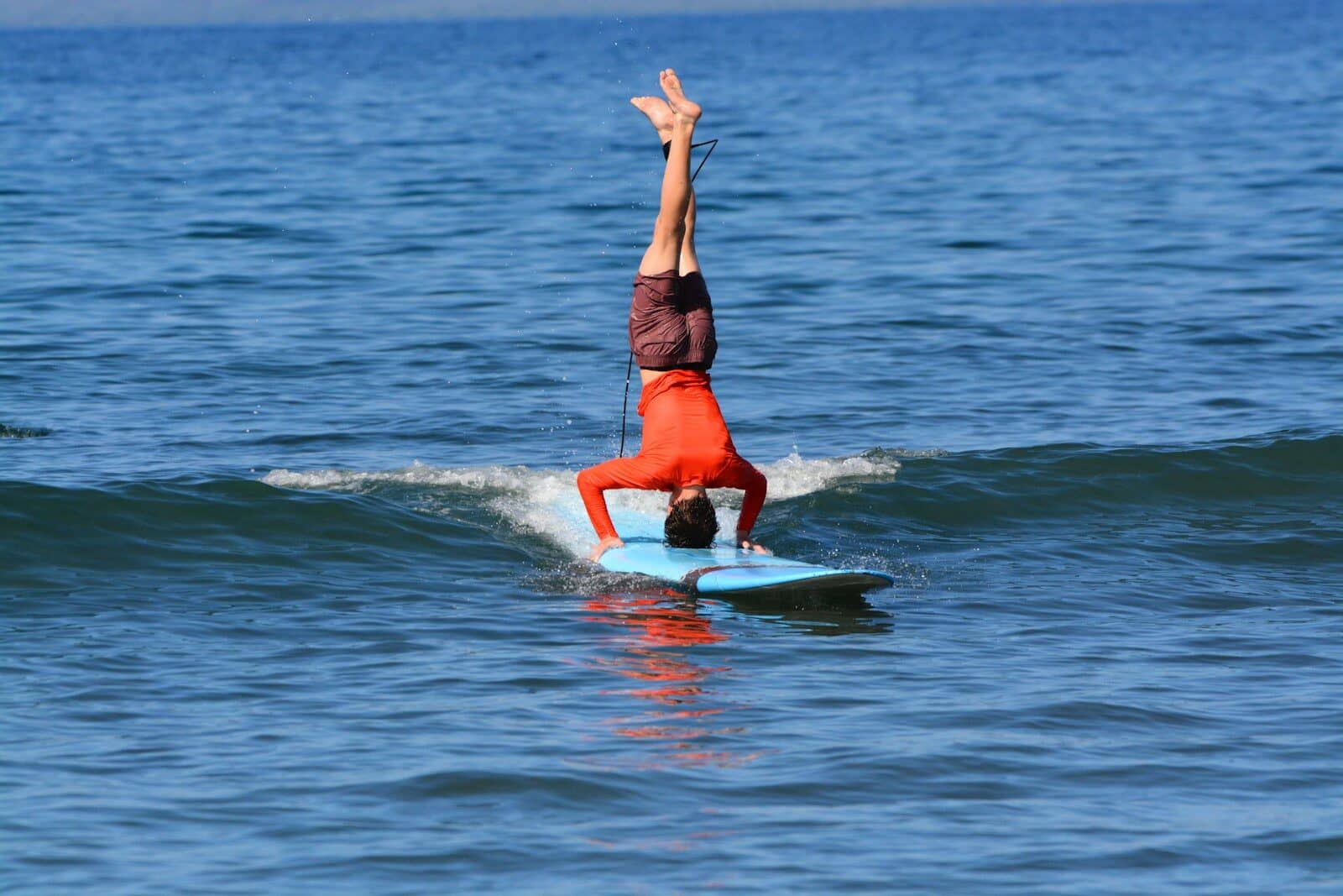 a person riding a surf board on a body of water Top Spring Break Destinations for Families and Adventure Seekers