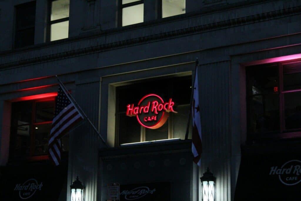 The hard rock cafe is lit up at night