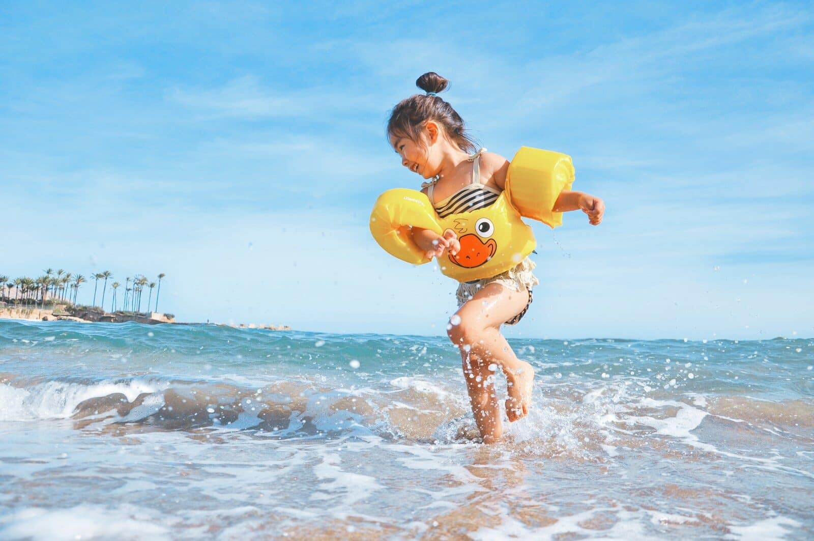 girl playing beside body of water during daytime Things to Do in Myrtle Beach with Kids for a Memorable Trip