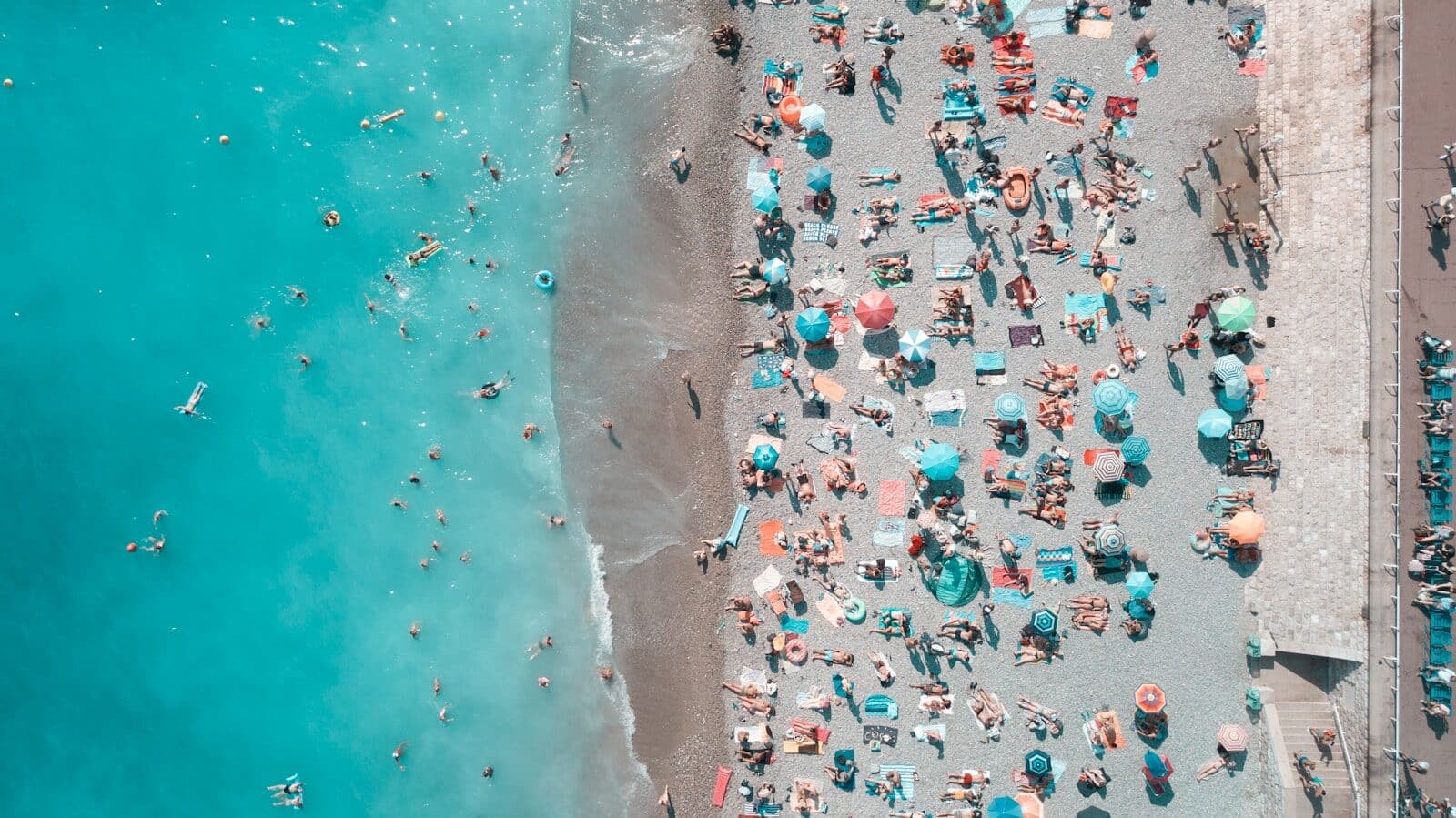 aerial photography of people on the beach When Is Spring Break 2025? Dates for Schools and Colleges Explained