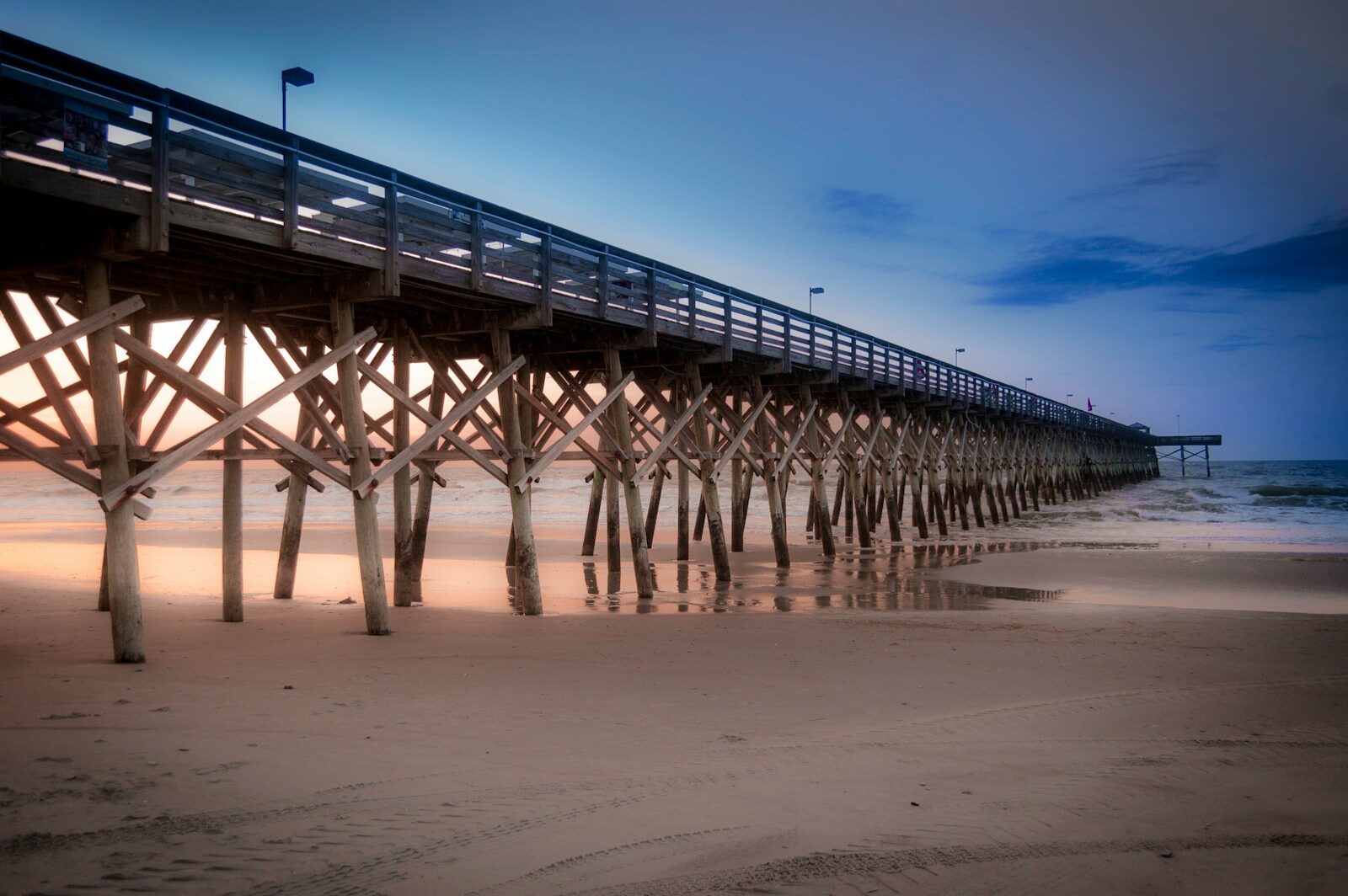 Photo by Windwhisper a long pier stretches out into the ocean