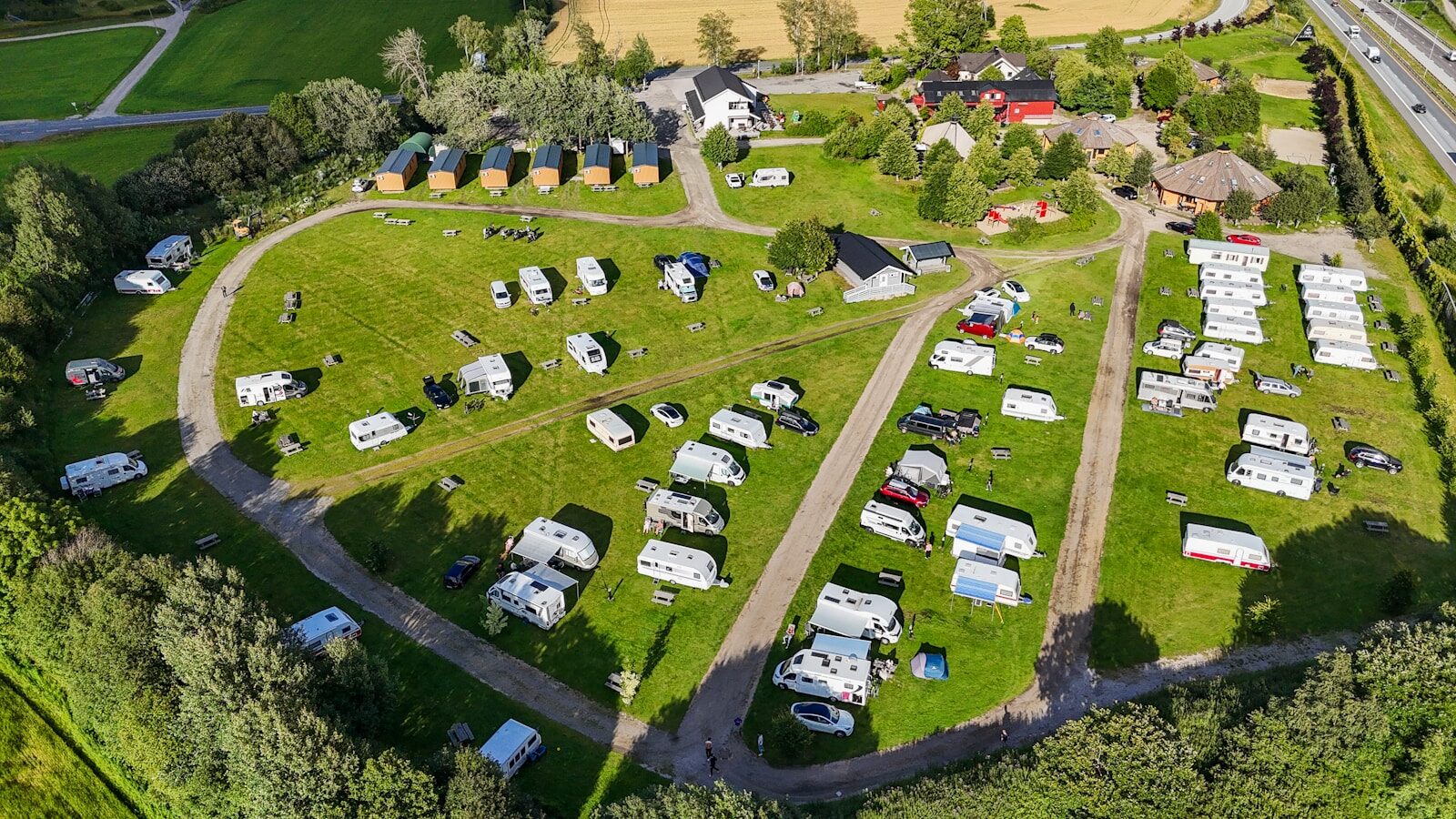 An aerial view of an rv park with many parked trailers