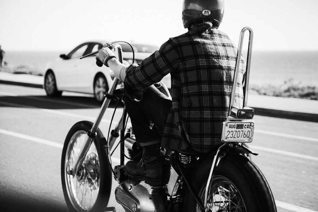 Bike Week Myrtle Beach 2024 | Ride the Waves of Excitement 11 grayscale photo of person wearing plaid dress shirt riding chopper motorcycle