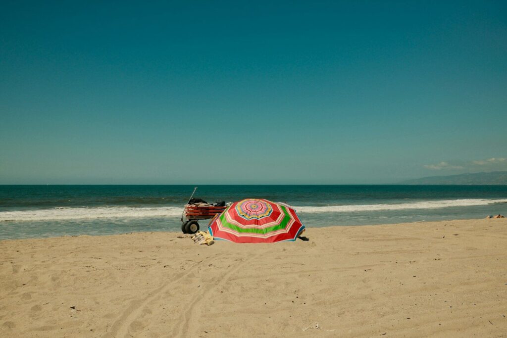 Beach umbrella and wagon on a sunny day